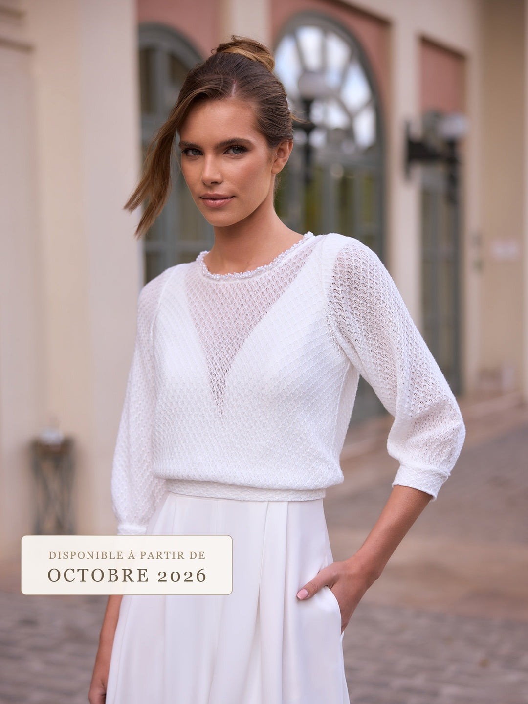 Top de mariée E549 en maille texturée ivoire, nouveauté Bianco Evento octobre 2026